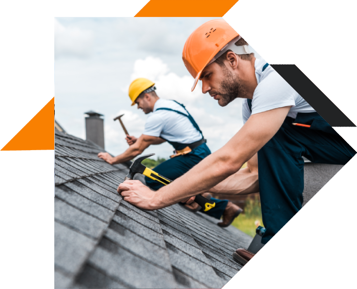 Roofers working on shingles